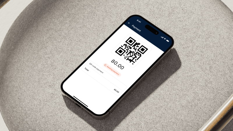 A mockup of an angled phone shows a QR code.